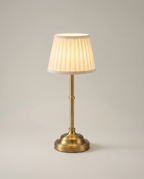 Pleated Brass cordless lamp, brass stem, pleated shade, USB-C dimmer, 40 cm — lit hero shot | Dalfa CH/FR