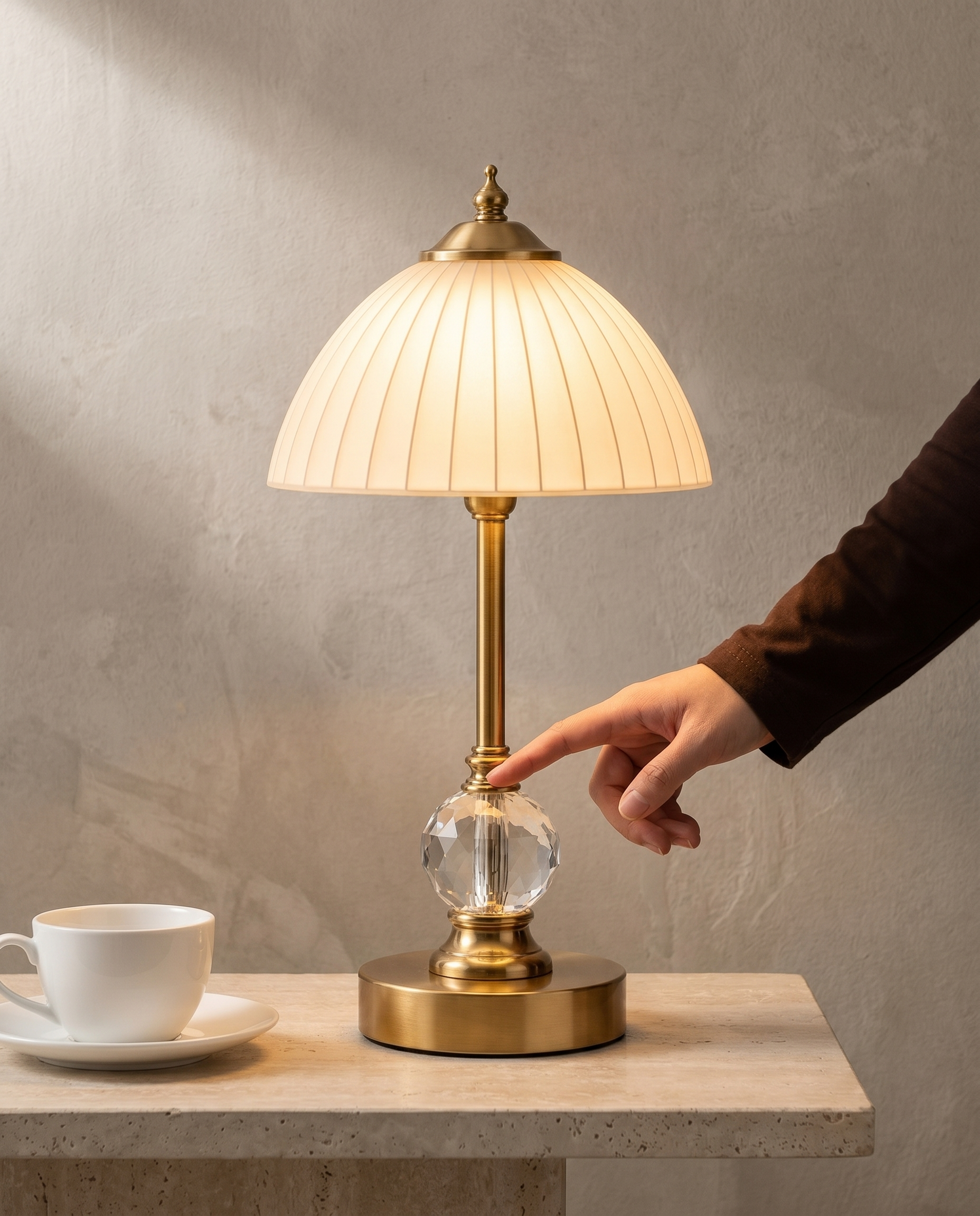 Ribbed Crystal brass lamp, frosted ribbed glass shade, cut crystal stem, 31.5 cm — in use, fingertip on the crystal sphere | Dalfa CH/FR