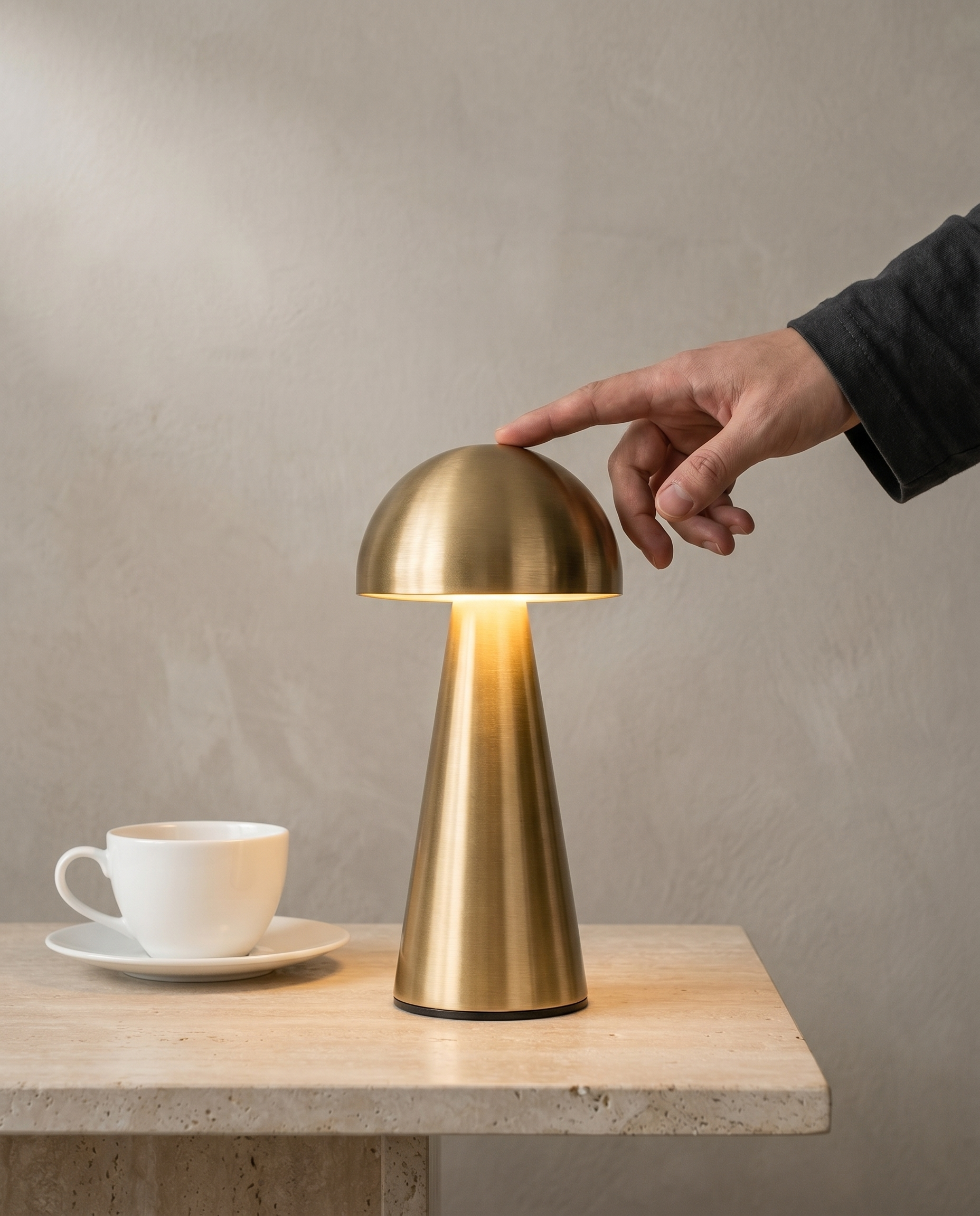 Copper Dome compact metal dome lamp, touch dimmer, USB-C cordless — in use, fingertip tilting the dome | Dalfa CH/FR