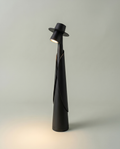 Matte black figure table lamp with hat spotlight lit, touch switch, USB-C, ~28 cm — studio hero | Dalfa CH/FR