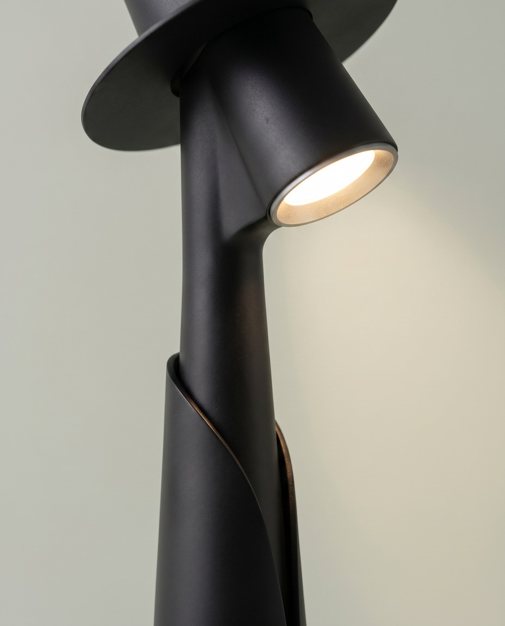 Close-up of the hidden LED spotlight under the hat brim, matte black figure lamp — detail | Dalfa CH/FR