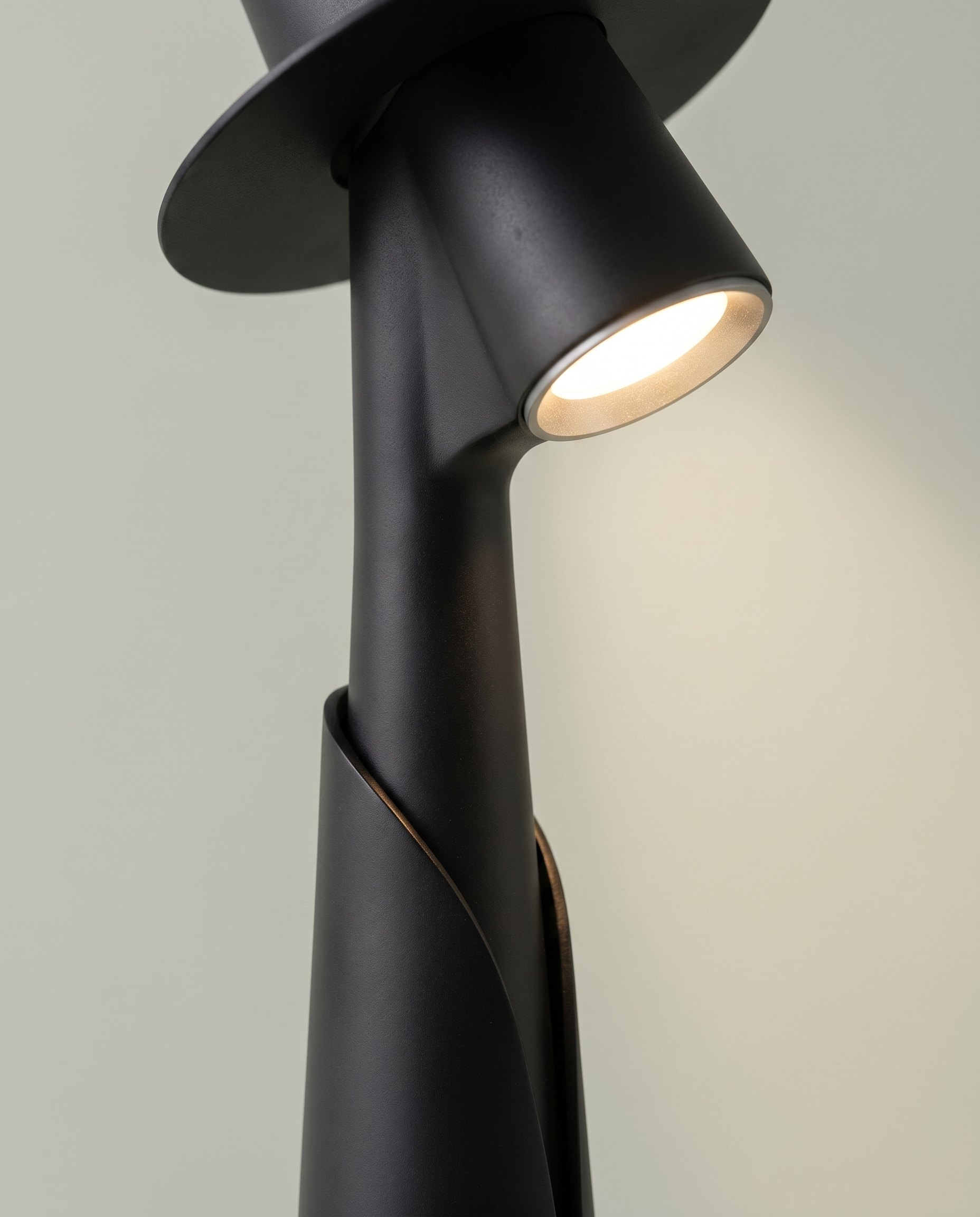 Close-up of the hidden LED spotlight under the hat brim, matte black figure lamp — detail | Dalfa CH/FR