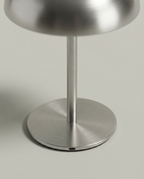Close-up of the brushed steel base and USB-C charging port — detail | Dalfa CH/FR